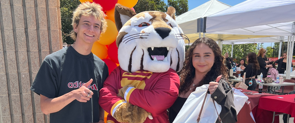 saddleback college mascot, blaze the bobcat, surrounded by students