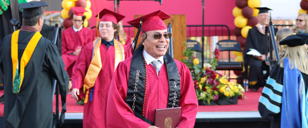 students walking at graduation