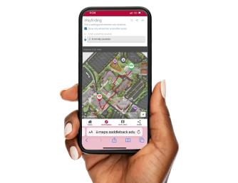 Hand holding a smartphone that is displaying the Saddleback College digital map