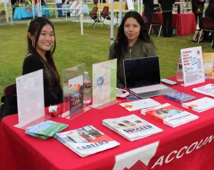 2 students from the Accounting Club offering information at the Involvement Fair