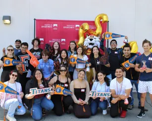A group of Saddleback College students transferring to CSUF pose together for a photo