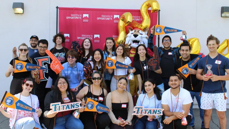 A group of Saddleback College students transferring to CSUF pose together for a photo