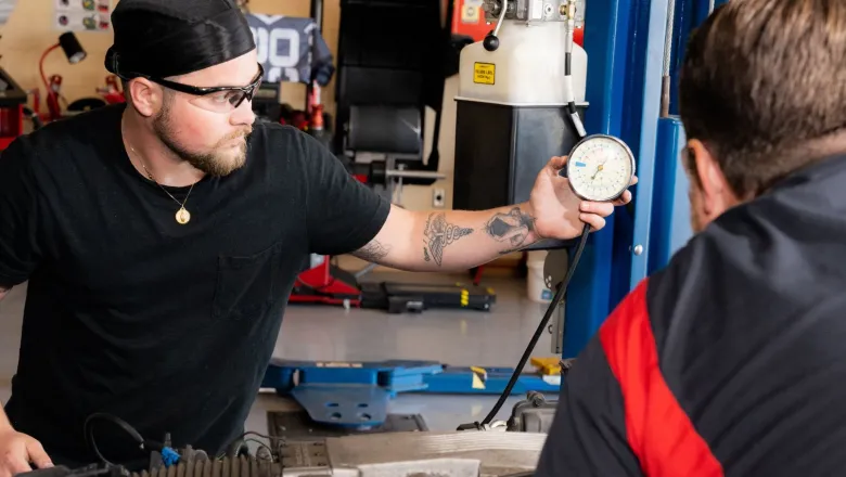 Automotive student checking gauge